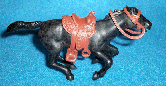 Marx original 60mm galloping western horse, black,with saddle + reins