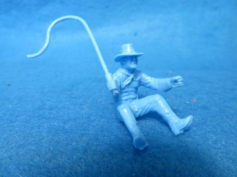 Wagon Driver in felt hat with whip in light blue